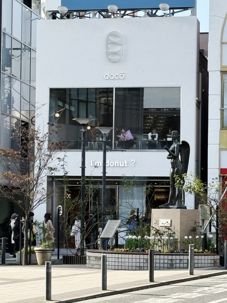 Exterior of I'm donut in Jiyugaoka Tokyo viewed from the train station entrance.