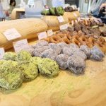 Assorted donuts including matcha, chocolate, and glazed varieties at I’m Donut in Jiyugaoka, Tokyo